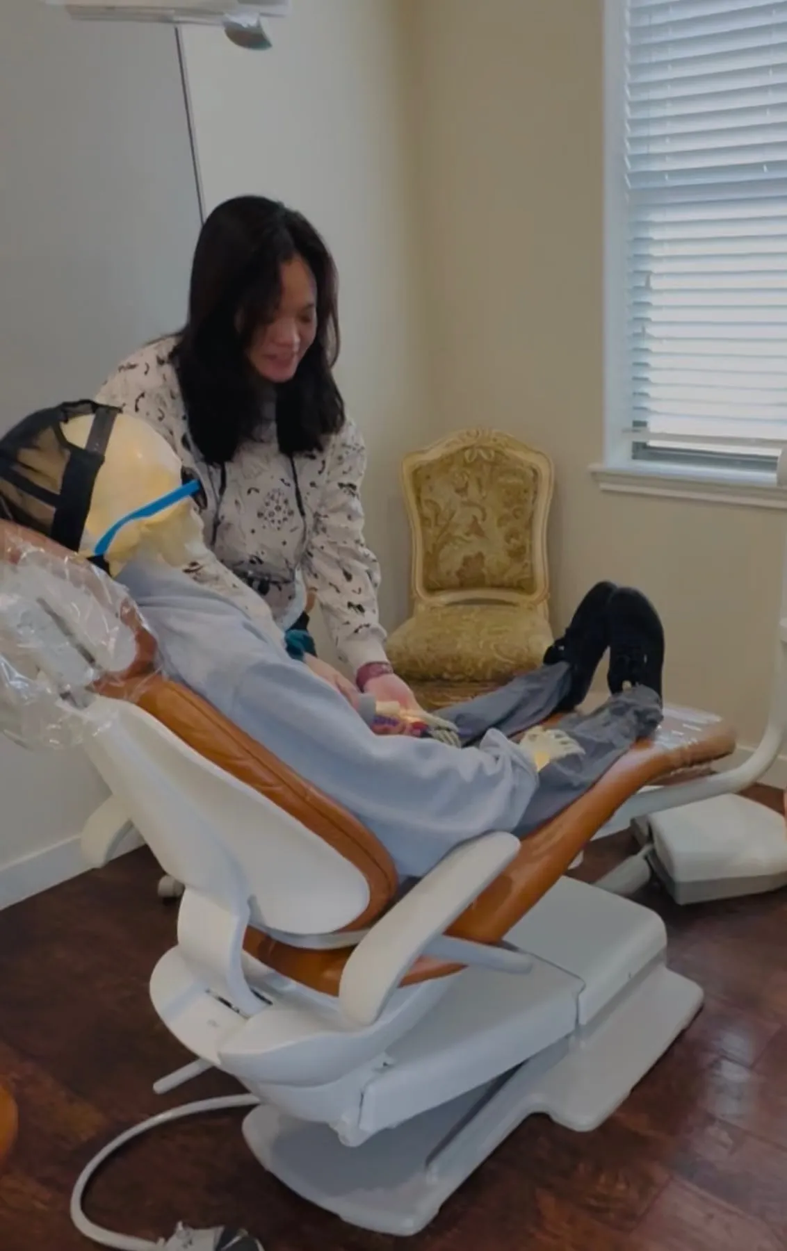 A Hutto Hippo Family Dental team member settling the skeleton into the dental chair