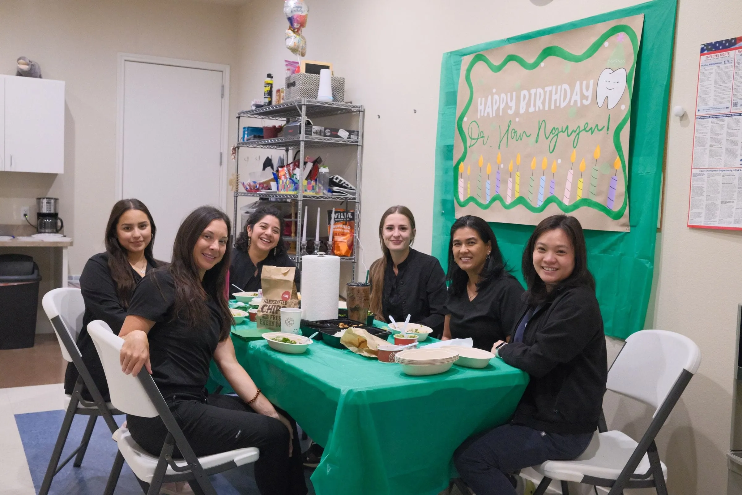 Dr. Han Nguyen and the Hutto Hippo Family Dental team celebrating together at the office